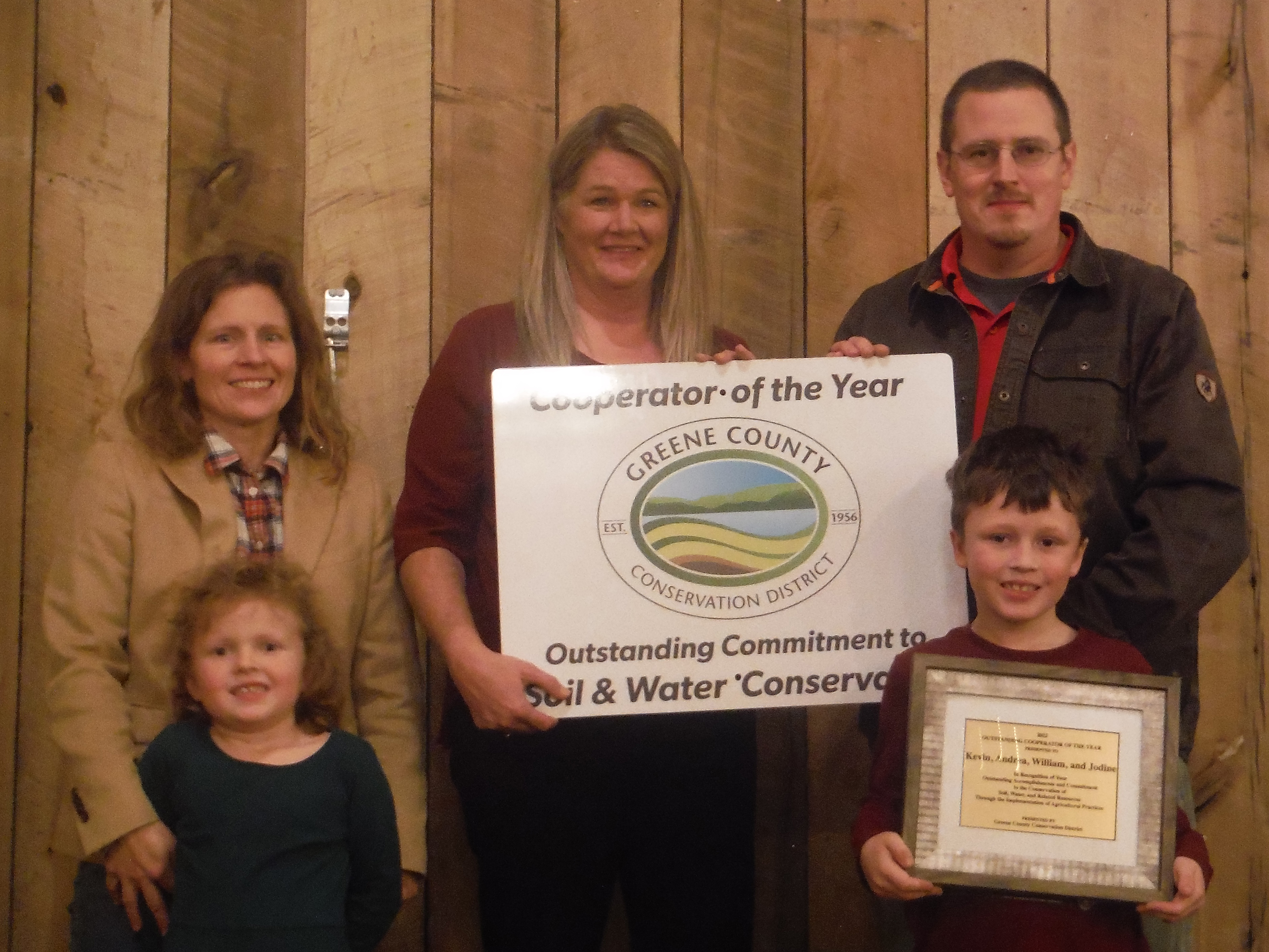 Lisa Snider. presented Kevin White along with his wife Andrea and children William and Jodine with the 2022 Outstanding Cooperator of the Year Award at the Greene County Conservation DistrictÃ¢â‚¬â„¢s annual award ceremony on Wednesday, Dec. 14